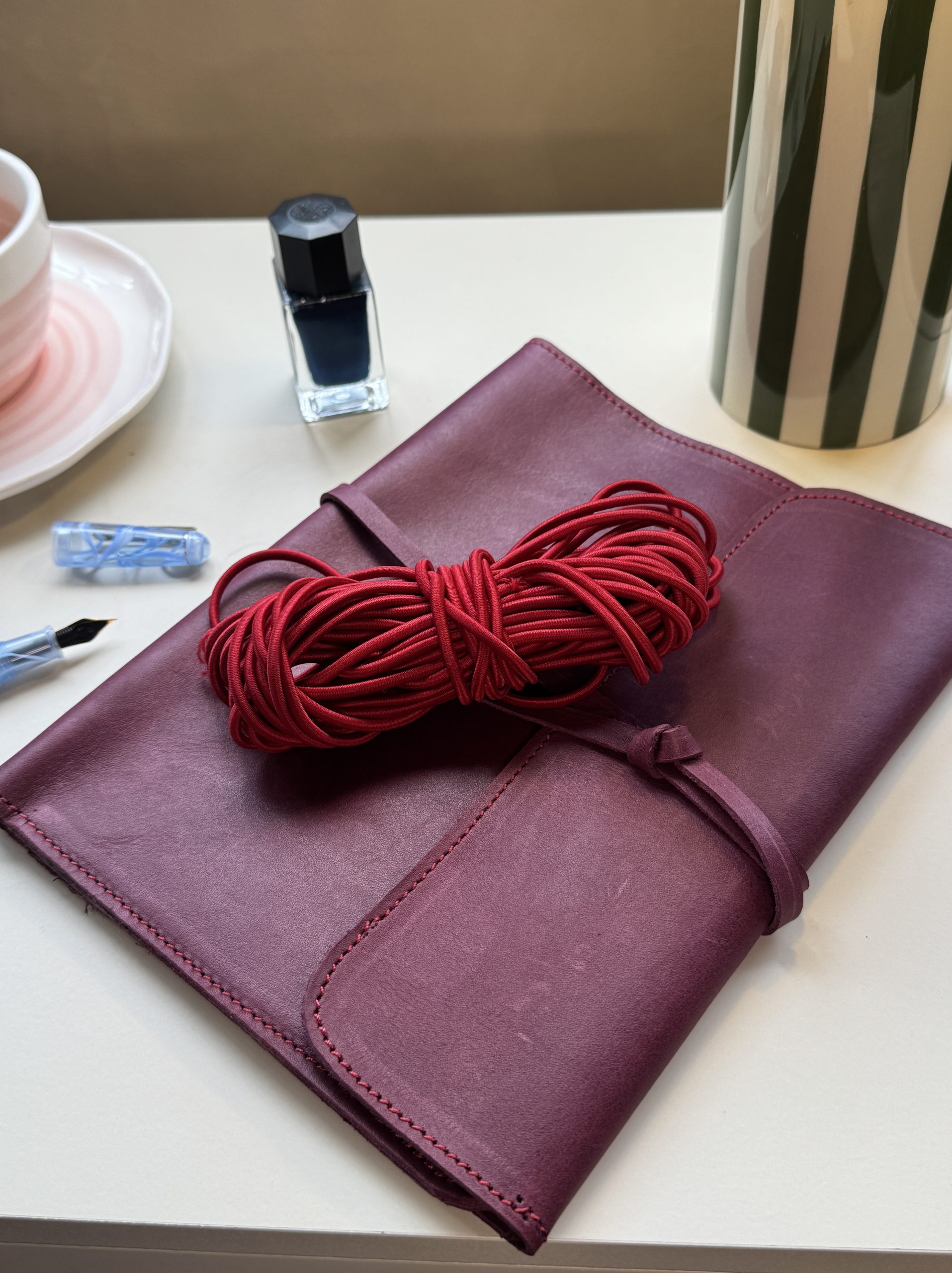 Red cord + plum leather folio - FORTExPenelope red cord + plum leather folio - FORTÉ x Penelope leather folio collaboration