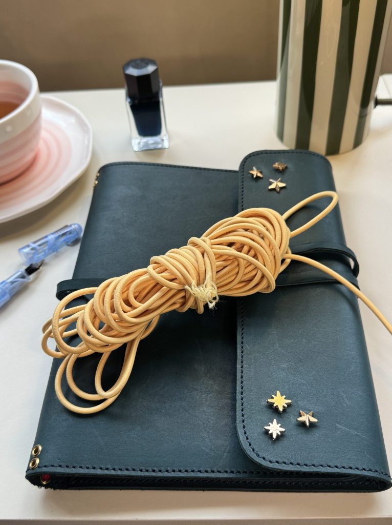 teal star embellished leather folio with butter yellow cord - FORTÉ x Penelope Leather Folio Collaboration