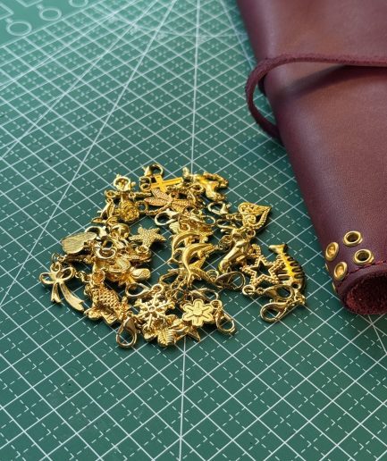 gold tone folio charms - FORTÉ x Penelope