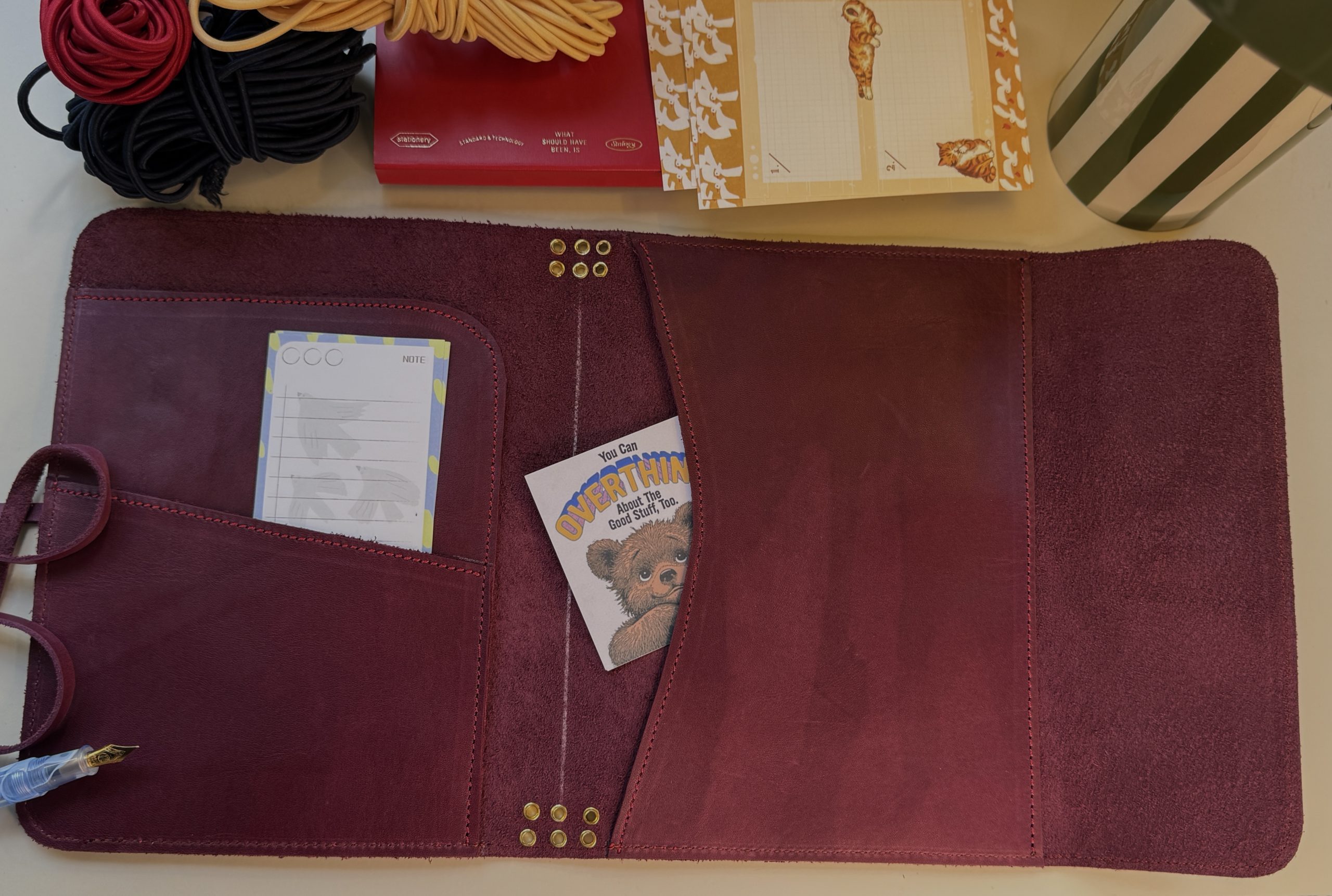 plum leather folio interior with prockets displayed -FORTExPenelope plum leather folio interior pockets on display - FORTÉ x Penelope Leather Folio collaboration